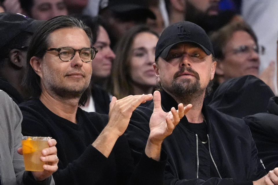 Actor Leonardo DiCaprio, right, watches during the second half in Game 4 of an NBA basketball first-round playoff series between the Los Angeles Lakers and the Denver Nuggets Saturday, April 27, 2024, in Los Angeles. (AP Photo/Mark J. Terrill)