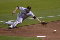 San Francisco Giants right fielder Darin Ruf dives for a foul ball hit by the Oakland Athletics' Marcus Semien during the third inning of a baseball game Friday, Sept. 18, 2020, in Oakland, Calif. (AP Photo/Eric Risberg)