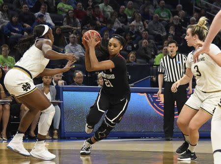 Apr 1, 2019; Chicago, IL, USA; Stanford Cardinal guard DiJonai Carrington (21) drives to the basket as Notre Dame Fighting Irish guard Jackie Young (5) defends her during the first half in the championship game of the Chicago regional in the women's 2019 NCAA Tournament at Wintrust Arena. Mandatory Credit: David Banks-USA TODAY Sports