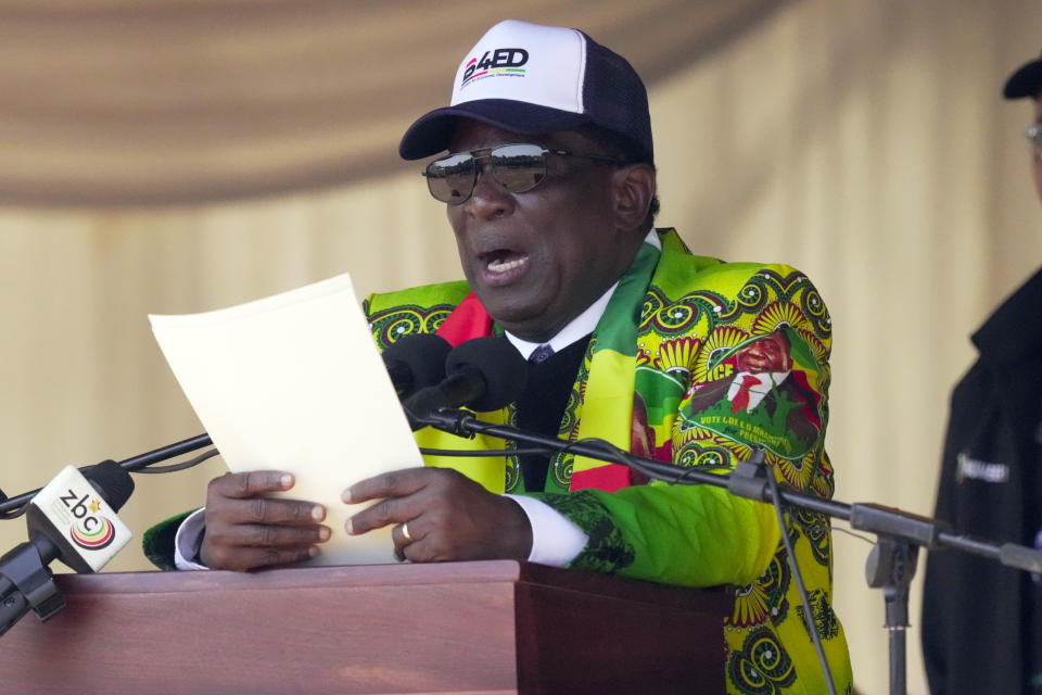 Zimbabwean President Emmerson Mnangagwa delivers his speech at a campaign rally in Harare, Wednesday, Aug. 9, 2023. Mnangagwa addressed thousands of supporters in a speech laden with calls for peace, days after his supporters were accused of stoning an opposition activist to death ahead of general elections set for Aug. 23. (AP Photo/Tsvangirayi Mukwazhi)