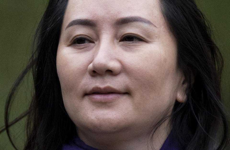 Chief Financial Officer of Huawei, Meng Wanzhou leaves her home in Vancouver, British Columbia, Wednesday, Oct. 28, 2020. Wanzhou is heading to the British Columbia Supreme Court in an evidentiary hearing on her extradition case. (Jonathan Hayward/The Canadian Press via AP)