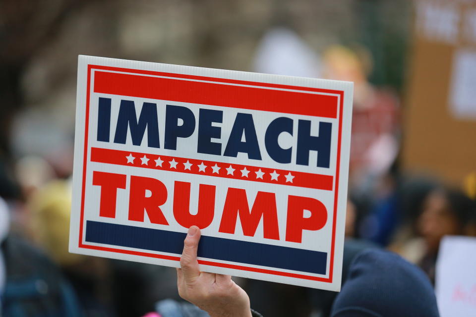 A man holds up an Impeach “Trump” sign during the Women’s Unity Rally hosted by a chapter of Women’s March National on Jan. 19, 2019 at Foley Square in New York City. (Photo: Gordon Donovan/Yahoo News)