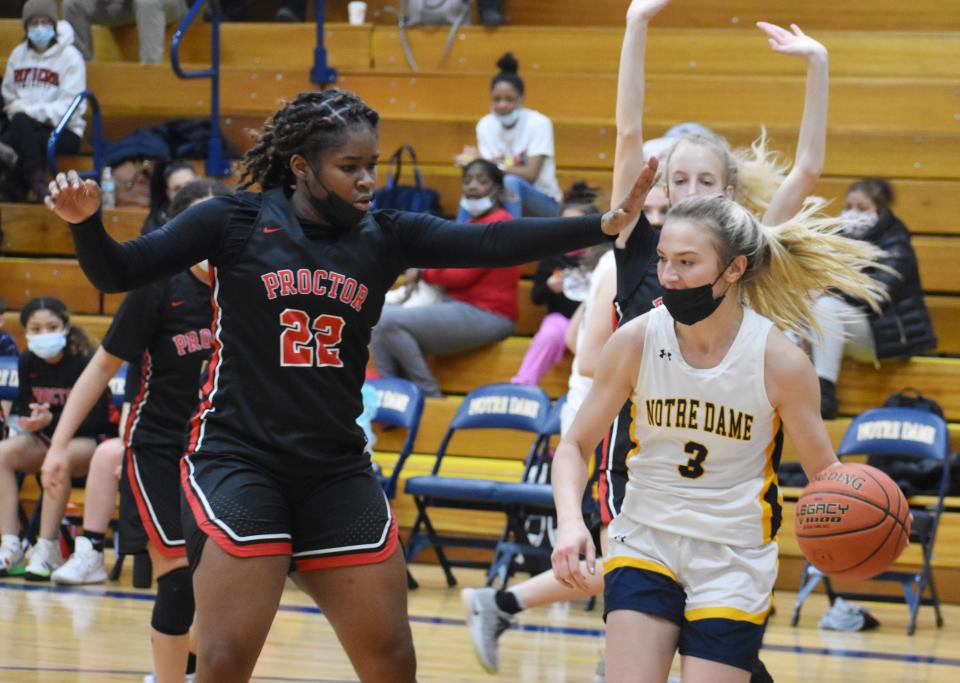 Proctor's Tamia Brown tries to halt the progress of Notre Dame's Haley Heffernan during the first half Thursday, Jan. 20, 2022 at Notre Dame High School.