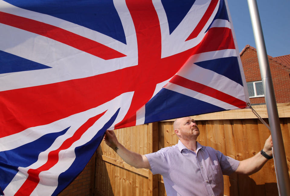 Ex-soldier Andrew Smith, 51, of Nottingham was told by a housing developer to stop flying his Union Jack flag. (SWNS)