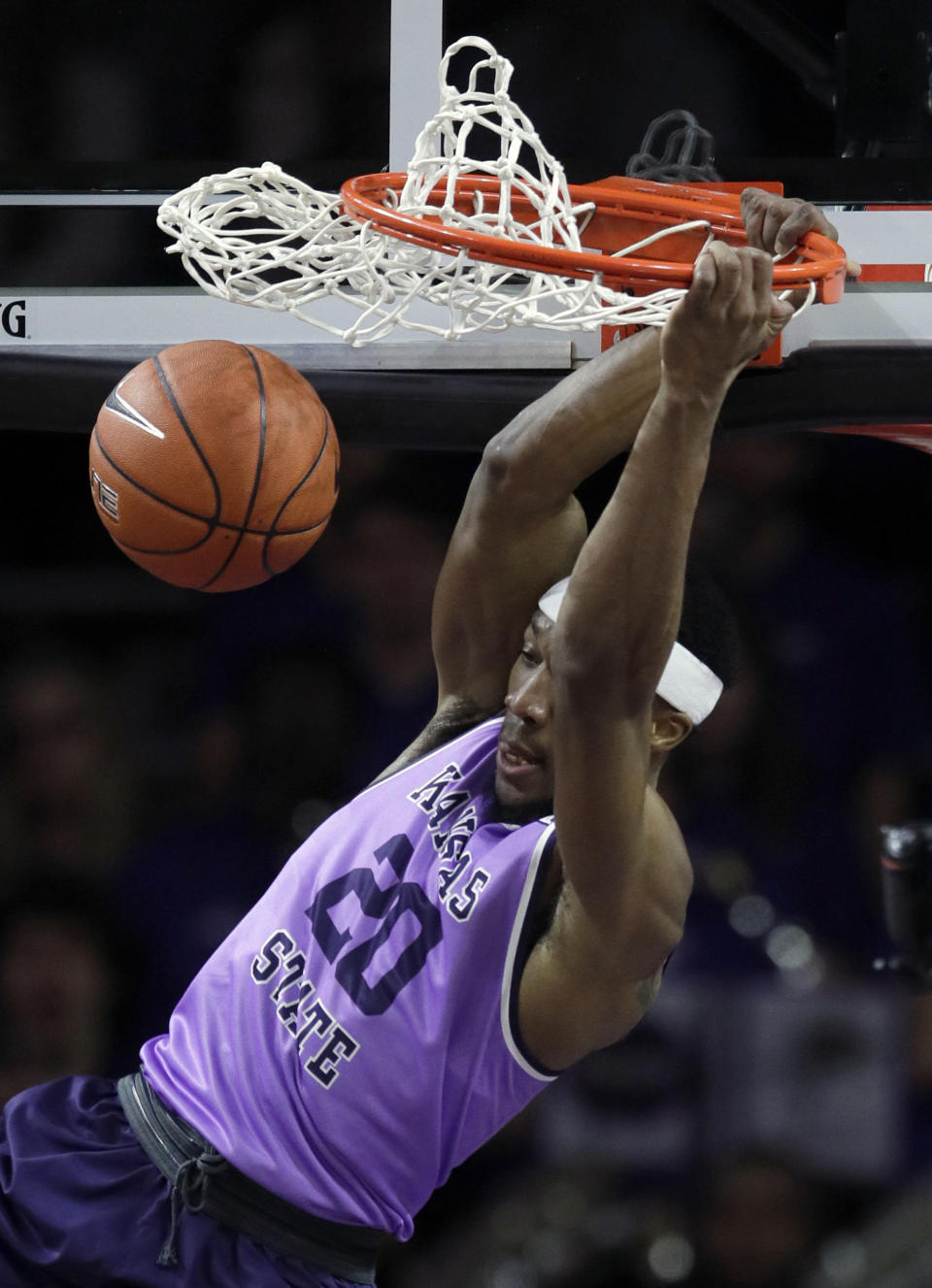 Kansas State forward Xavier Sneed dunks during the first half of an NCAA college basketball game against Oklahoma State in Manhattan, Kan., Saturday, Feb. 23, 2019. (AP Photo/Orlin Wagner)