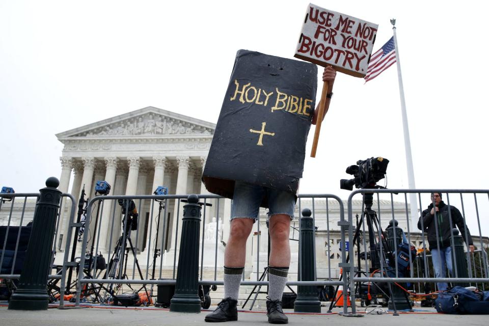 A demonstrator in front of the U.S. Supreme Court on Dec. 5, 2017, when it was hearing the Masterpiece Cakeshop case. <a href="https://newsroom.ap.org/detail/SupremeCourtWeddingCake/eed35f89f3244786aed5ac650a58d24a/photo?Query=masterpiece%20cakeshop&mediaType=photo&sortBy=&dateRange=Anytime&totalCount=105&currentItemNo=58" rel="nofollow noopener" target="_blank" data-ylk="slk:AP Photo/Jacquelyn Martin;elm:context_link;itc:0;sec:content-canvas" class="link ">AP Photo/Jacquelyn Martin</a>