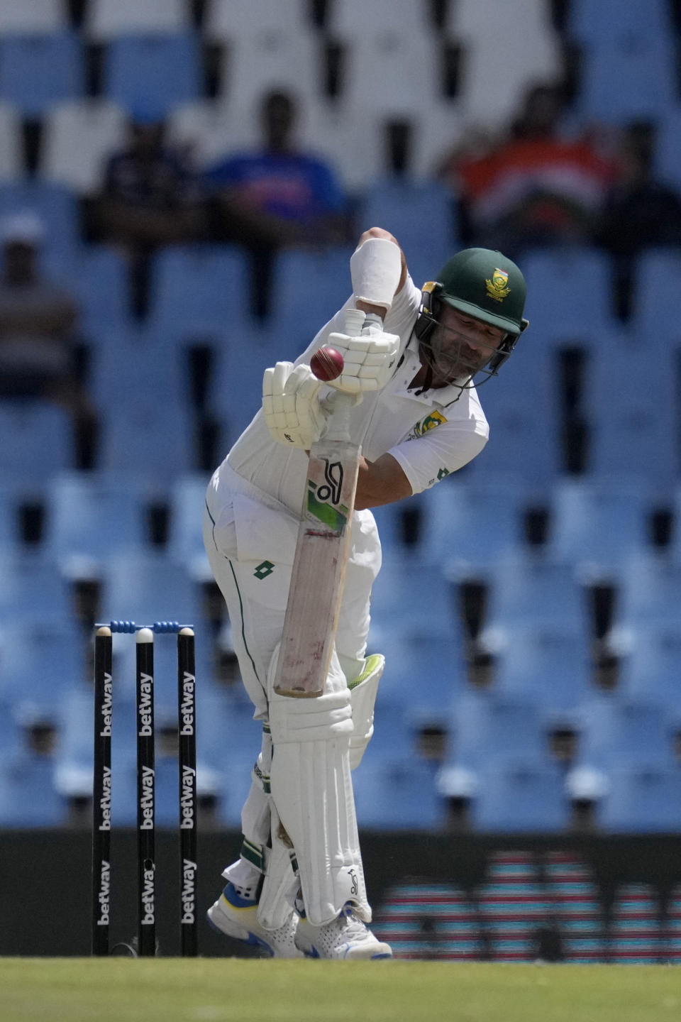 South Africa's batsman Dean Elgar takes evasive action against a high ball from India's bowler Mohammed Siraj during the third day of the Test cricket match between South Africa and India, at Centurion Park, in Centurion, on the outskirts of Pretoria, South Africa, Thursday, Dec. 28, 2023. (AP Photo/Themba Hadebe)