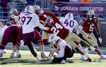 Boston College cornerback Amari Jackson (24) attempts to block a point after kick by Virginia Tech place-kicker John Love (97) during the second half of an NCAA college football game Saturday, Nov. 11, 2023 in Boston. (AP Photo/Mark Stockwell)