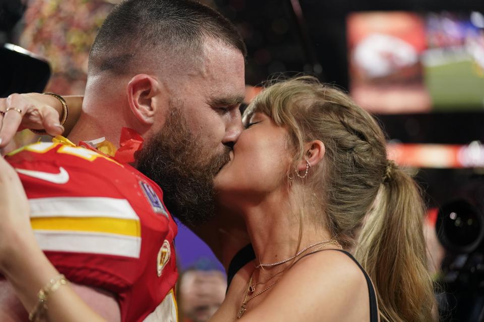 Taylor Swift kisses Kansas City Chiefs tight end Travis Kelce after the NFL Super Bowl 58 football game against the San Francisco 49ers, Sunday, Feb. 11, 2024, in Las Vegas. The Chiefs won 25-22 against the 49ers. (AP Photo/Brynn Anderson)