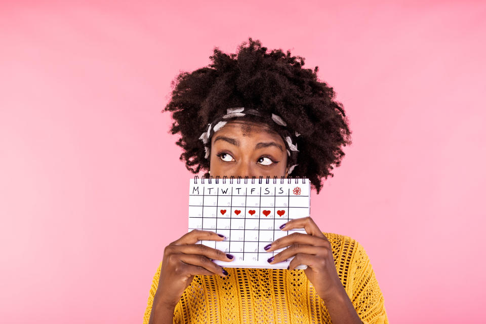 woman holding a calendar