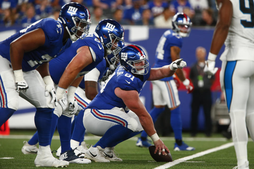 New York Giants' John Michael Schmitz Jr. (61), right, gestures during the first half of an NFL preseason football game against the Carolina Panthers, Friday, Aug. 18, 2023, in East Rutherford, N.J. (AP Photo/John Munson)