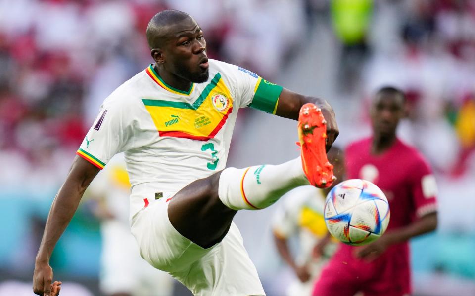 Senegal's Kalidou Koulibaly connects a shot during a World Cup group A soccer match against Qatar - AP