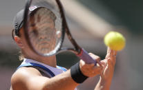 Australia's Ashleigh Barty plays a return to United States's Bernarda Pera during their first round match on day three of the French Open tennis tournament at Roland Garros in Paris, France, Tuesday, June 1, 2021. (AP Photo/Christophe Ena)