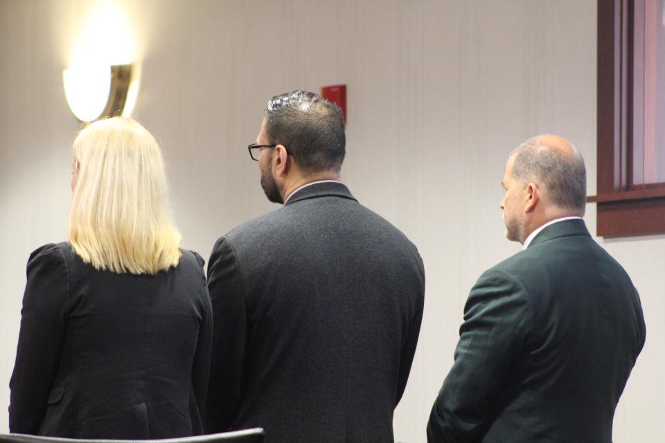 Gurpreet Singh, 41, standing with his attorneys, Alex Deardorff (left) and Mark Wieczorek (right), while a three-judge panel in Butler County Common Pleas Court renders its guilty verdict.