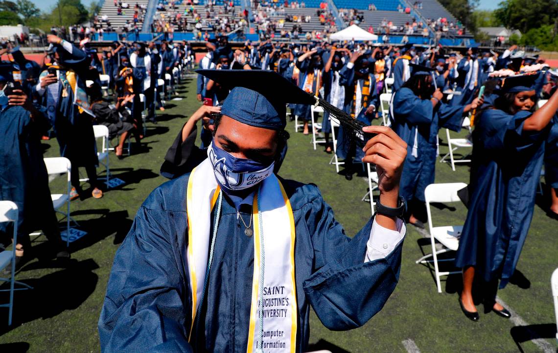 Class of 2020 graduate Alcion Thompson turns his tassel during commencement exercises for the Classes of 2020 and 2021 at St. Augustine’s University in Raleigh, N.C., Saturday, May 1, 2021.