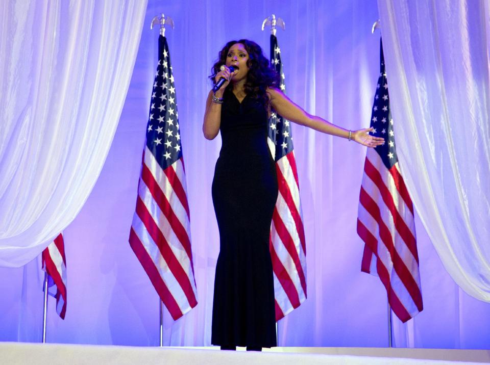 Jennifer Hudson sings as President Barack Obama and first lady Michelle Obama dance together at an Inaugural Ball, Monday, Jan. 21, 2013, at the Washington Convention Center in Washington, during the 57th Presidential Inauguration. (AP Photo/Carolyn Kaster)