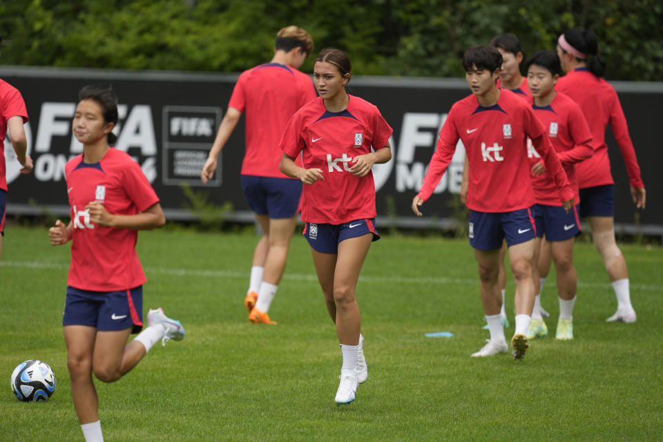 FILE - South Korea's women national soccer team player Casey Phair, center, warms up during a training session ahead of the FIFA Women's World Cup at the National Football Center in Paju, South Korea, Friday, June 30, 2023. South Korea will compete in the Group H at the FIFA Women's World Cup with Germany, Morocco and Colombia. (AP Photo/Lee Jin-man, File)