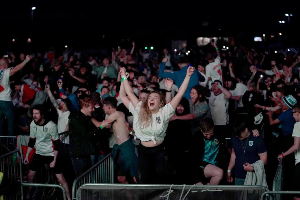 Fans in Manchester celebrate England qualifying for the Euro 2020 final (PA Wire)