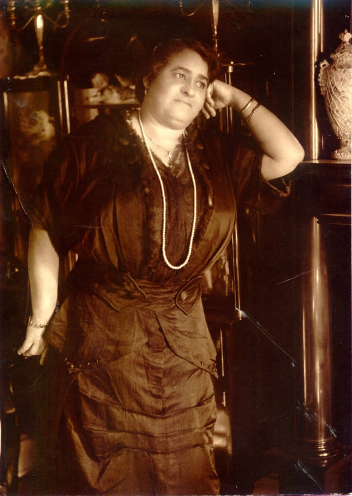 Maggie L. Walker, standing in the parlor of her home. | National Park Service Museum Collections