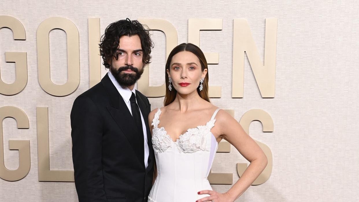 robbie arnett and elizabeth olsen at the 2024 golden globes