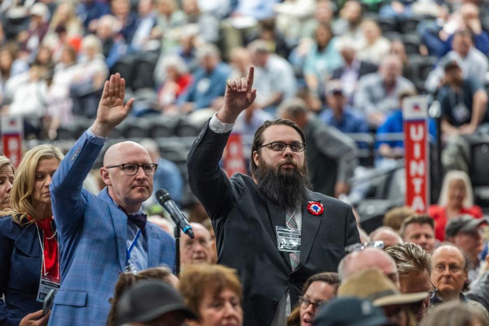 Attendees raise their hands during the Utah Republican Party Organizing Convention at Utah Valley University in Orem on Saturday, April 22, 2023. | Ryan Sun, Deseret News