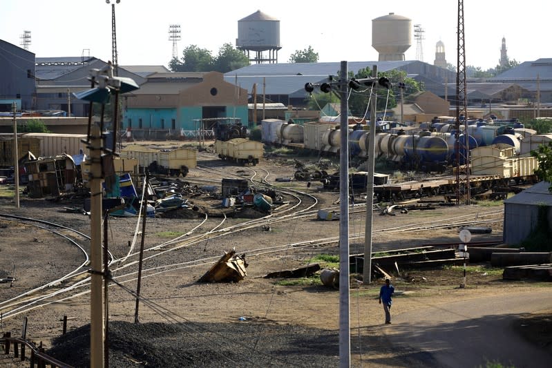 A man walks within the workshop area at the Atbara railway station in Nile State