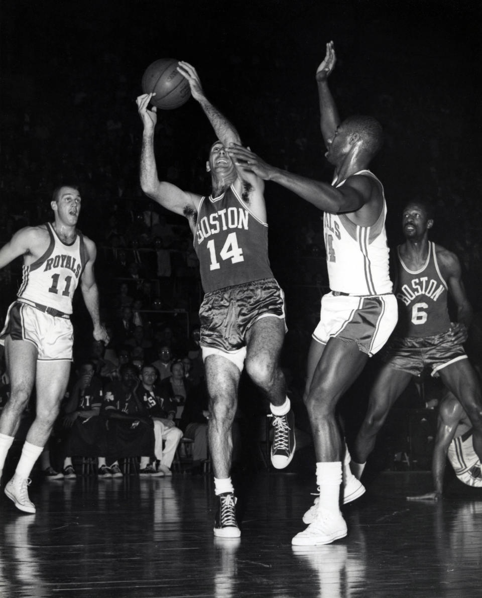 Unknown date; Cincinnati, OH, USA; FILE PHOTO; Boston Celtics guard Bob Cousy (14) drives to the basket against <a class="link " href="https://sports.yahoo.com/nba/teams/sacramento/" data-i13n="sec:content-canvas;subsec:anchor_text;elm:context_link" data-ylk="slk:Cincinnati Royals;sec:content-canvas;subsec:anchor_text;elm:context_link;itc:0">Cincinnati Royals</a> guard Oscar Robertson (14) and Arlen Brockhorn (11) as Bill Russell (6) looks on at Cincinnati Gardens. Malcolm Emmons-USA TODAY Sports