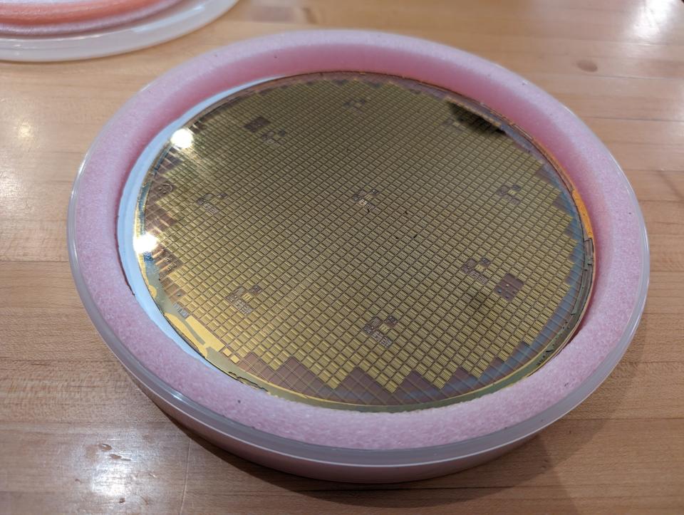 A microchip wafer, housing hundreds of microchips manufactured by Menlo.