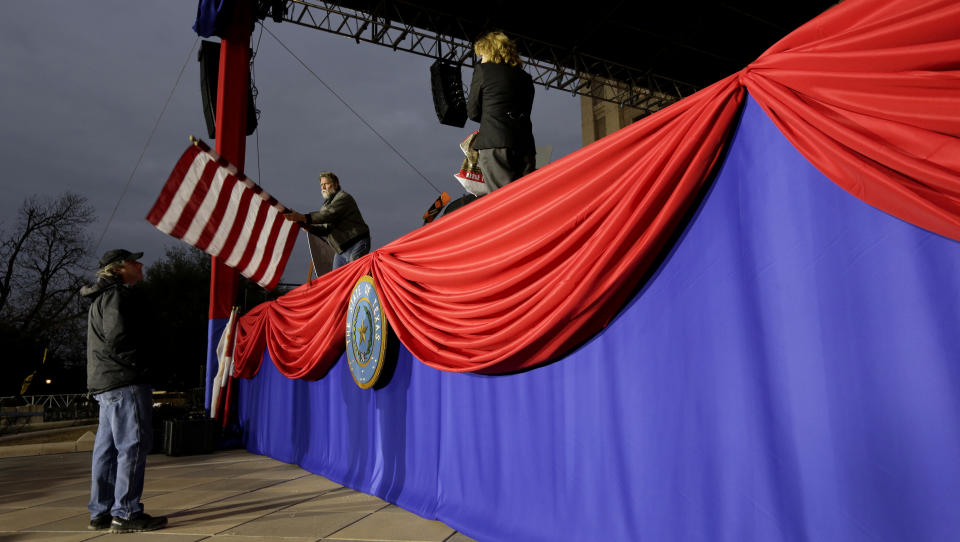 Workers prepare the grounds of the Texas State Capitol for Tuesday's Inauguration Ceremonies, in Austin, Texas, Monday, Jan. 14, 2019. (AP Photo/Eric Gay)