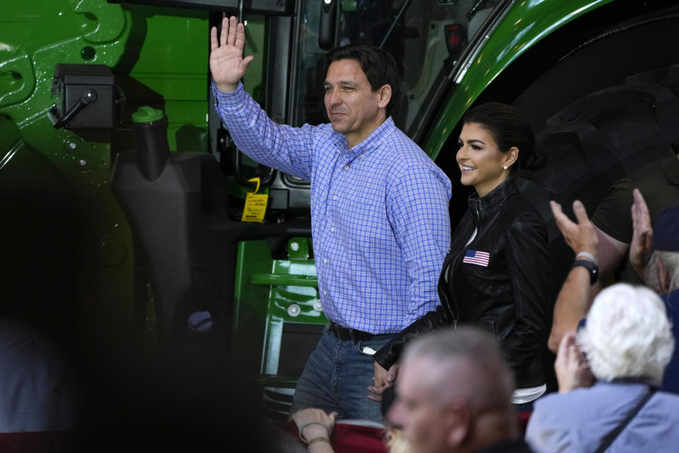 Republican presidential candidate and Florida Gov. Ron DeSantis and his wife, Casey, walk to the stage during U.S. Sen. Joni Ernst's Roast and Ride, Saturday, June 3, 2023, in Des Moines, Iowa. (AP Photo/Charlie Neibergall)