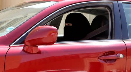 A woman drives a car in Riyadh, Saudi Arabia on October 22, 2013. REUTERS/Faisal Al Nasser/Files