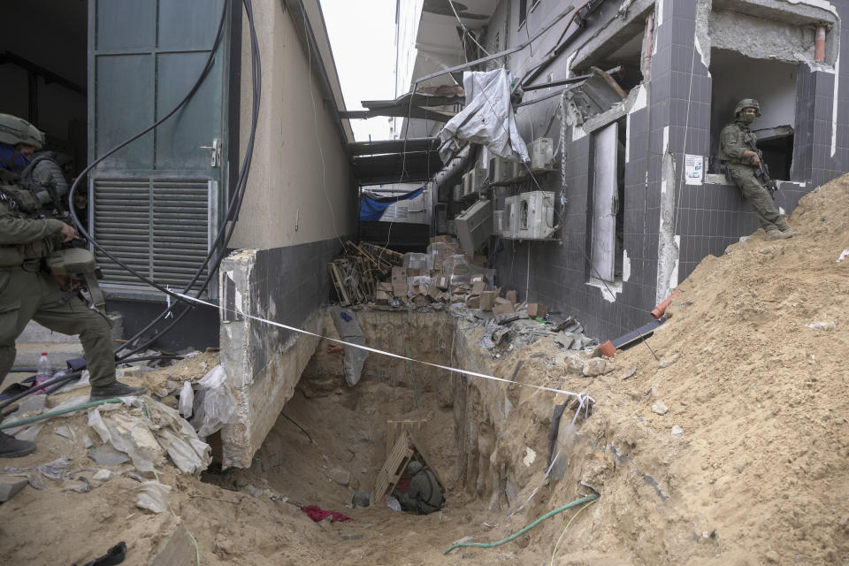 Israeli soldiers show the media an underground tunnel found underneath Shifa Hospital in Gaza City, Wednesday, Nov. 22, 2023. Israel says that Hamas militants sought cover on the grounds of the hospital and used the tunnel for military purposes. (AP Photo/Victor R. Caivano)