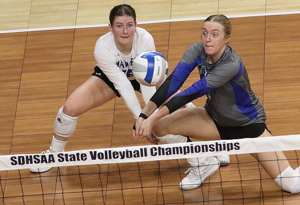 Sioux Falls Christian's Brietta Tims (right) and Lavin Maddox go for the dig during a Class A first-round match against Lennox in the state high school volleyball tournament on Thursday, Nov. 16, 2023 in the Summit Arena at The Monument in Rapid City.