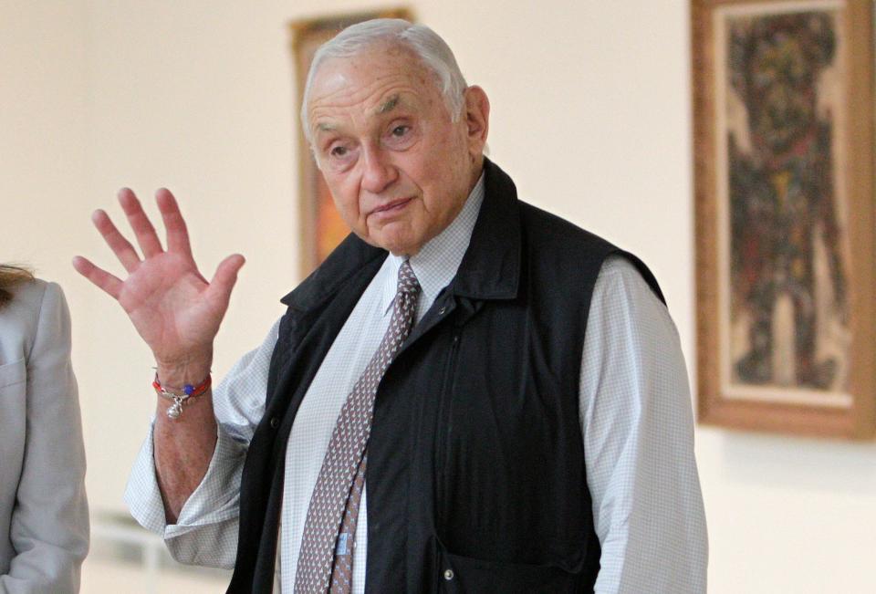 FILE - This Sept. 19, 2014 file photo shows Chairman and CEO of Victoria's Secret parent L Brands Les Wexner touring the exhibit at the Wexner Center for the Arts in Columbus, Ohio. Wexner is one of the numerous people who has been getting renewed attention because of the recently released court documents related to financier Jeffrey Epstein. Many of those people have never been accused of any wrongdoing, but have nonetheless become the subject of a whirlwind of conspiracy theories. (AP Photo/Jay LaPrete, File) ORG XMIT: XKS101