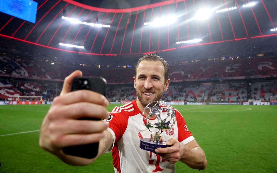 Harry Kane of Bayern Munich poses for a photo with the PlayStation Player Of The Match award after the team's victory in the UEFA Champions League 2023/24 round