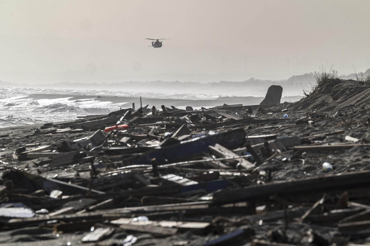 Debris washed ashore by sea at a beach near Cutro, southern Italy, Monday, Feb. 27, 2023. Nearly 70 people died in last week's shipwreck on Italy's Calabrian coast. The tragedy highlighted a lesser-known migration route from Turkey to Italy for which smugglers charge around 8,000 euros per person. (Giovanni Isolino/LaPresse via AP, File)