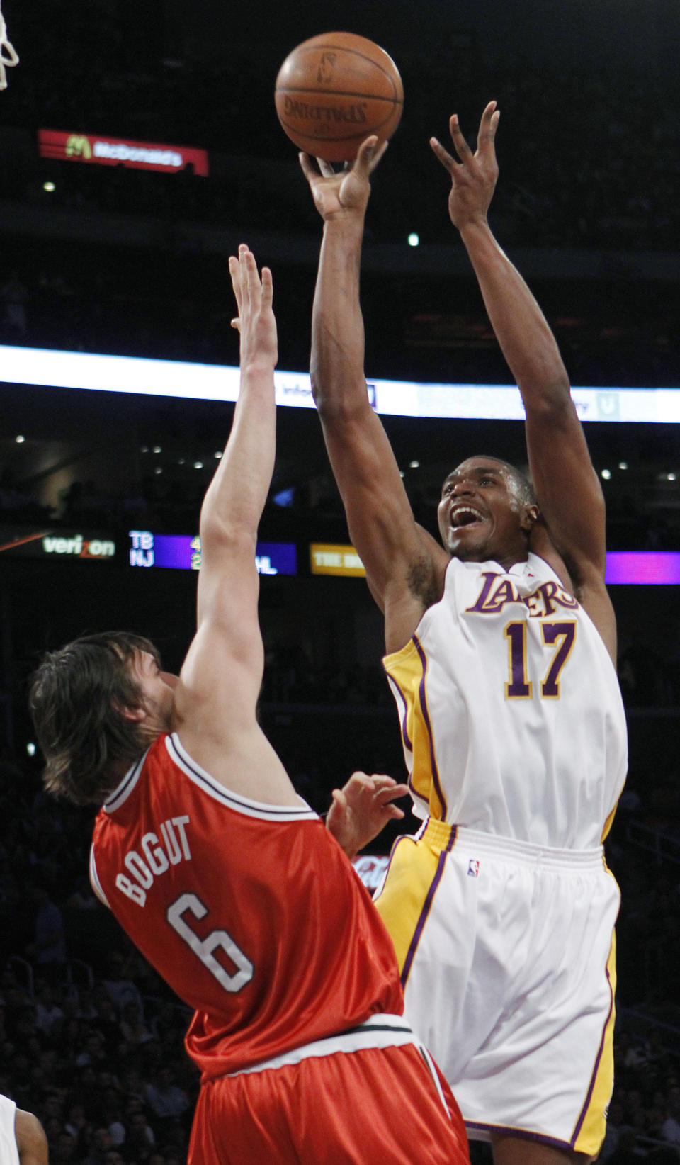 FILE - In this Jan. 10, 2010 file photo, Los Angeles Lakers center Andrew Bynum (17) shoots over Milwaukee Bucks center Andrew Bogut (6) during the first half of an NBA basketball game in Los Angeles. . On Saturday, Feb. 1, 2014, the Pacers added size and scoring punch to their roster by signing mercurial free agent center Andrew Bynum for the rest of the season. Team officials did not release additional details about the contract and said Bynum was expected to join the team sometime next week. (AP Photo/Lori Shepler, File)