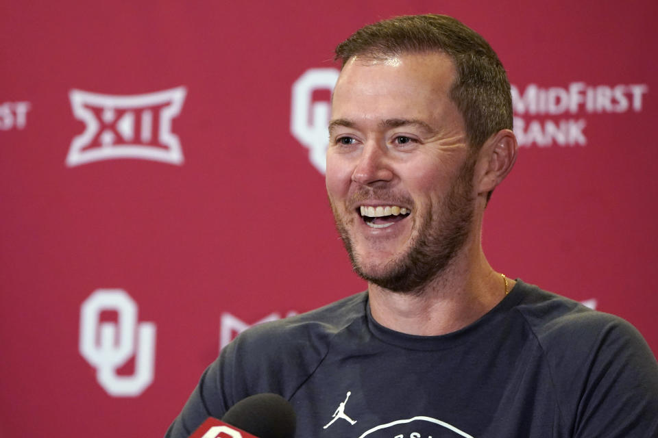 FILE - Then Oklahoma head coach Lincoln Riley answers a question during an NCAA college football news conference in Norman, Okla., on Aug. 31, 2021. Riley, one of college football's most successful young coaches who won 85 percent of his games in five seasons at Oklahoma and led the Sooners to four Big 12 titles and four New Year's Six bowls with three College Football Playoff appearances, has been named the head coach at USC, athletic director Mike Bohn announced Sunday, Nov. 28, 2021. (AP Photo/Sue Ogrocki, File)