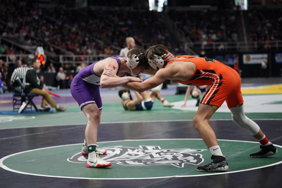 Tioga's Caden Bellis, left, wrestles in the second round matches of the NYSPHSAA Wrestling Championships at MVP Arena in Albany, on Friday, February 24, 2023.