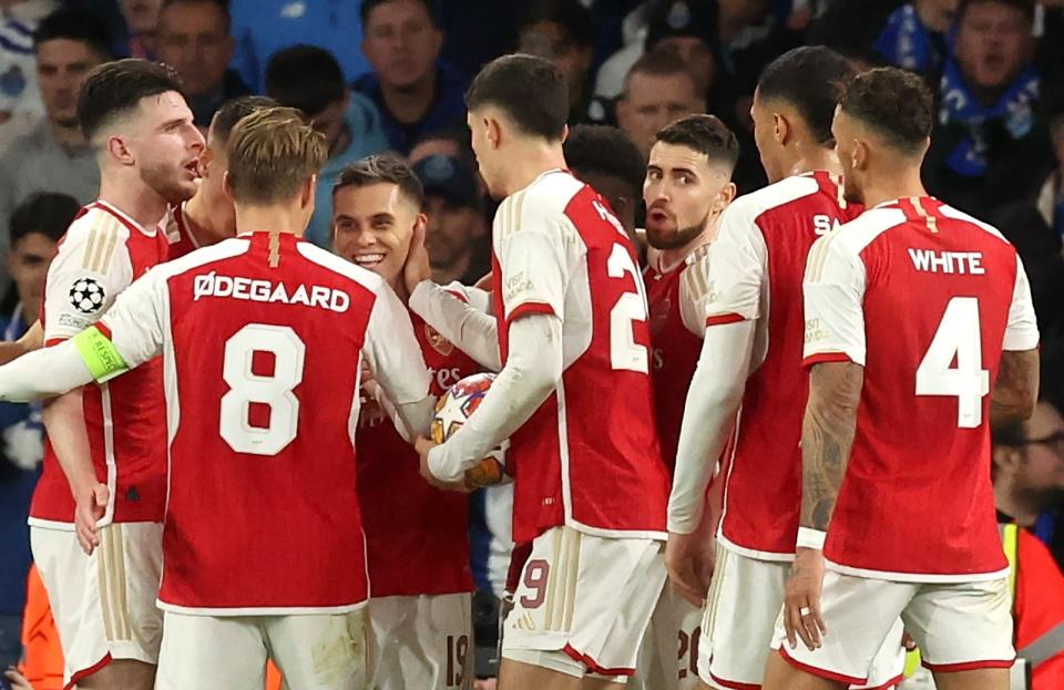 Arsenal teammates congratulate Trossard (EPA)