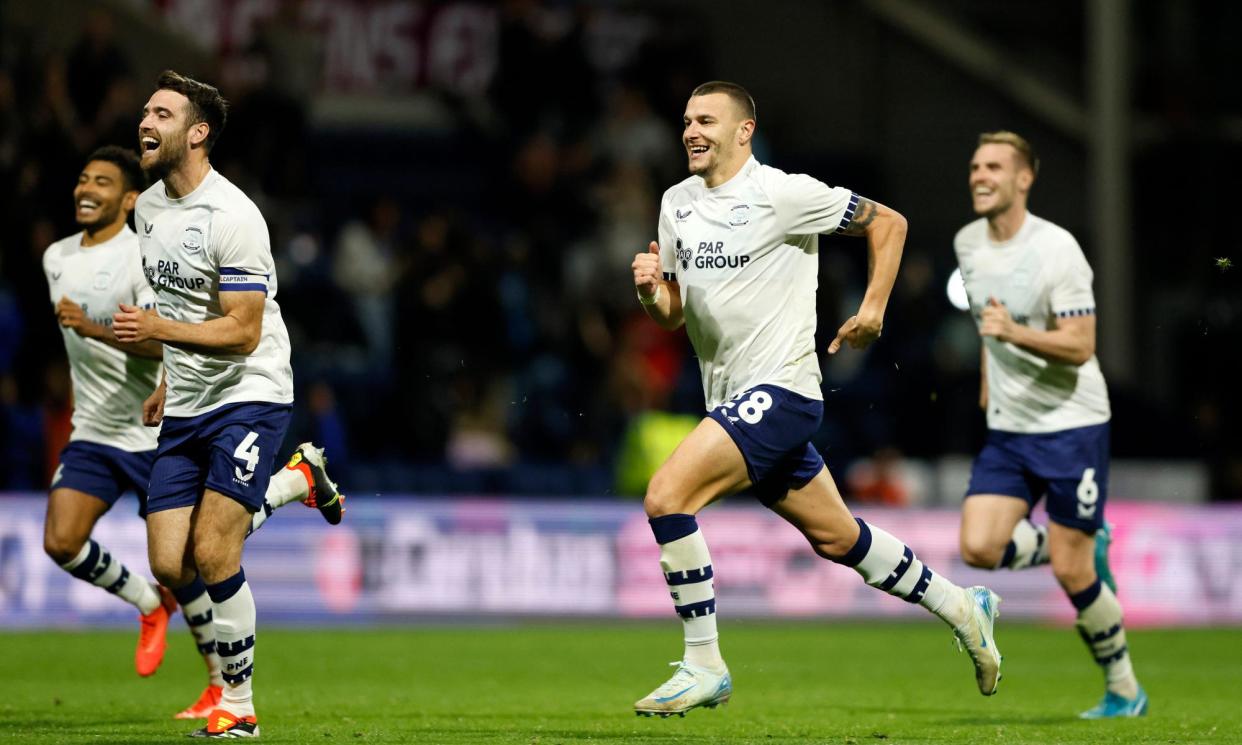 <span>Preston players run to celebrate with Ryan Ledson after he converted the winning spot-kick.</span><span>Photograph: Richard Sellers/PA</span>