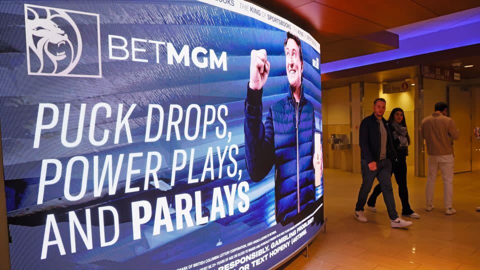 Fans walk past BetMGM signage featuring Wayne Gretzky prior to the game between the New York Rangers and the Carolina Hurricanes at Madison Square Garden on November 02, 2023 in New York City. - Bruce Bennett/Getty Images