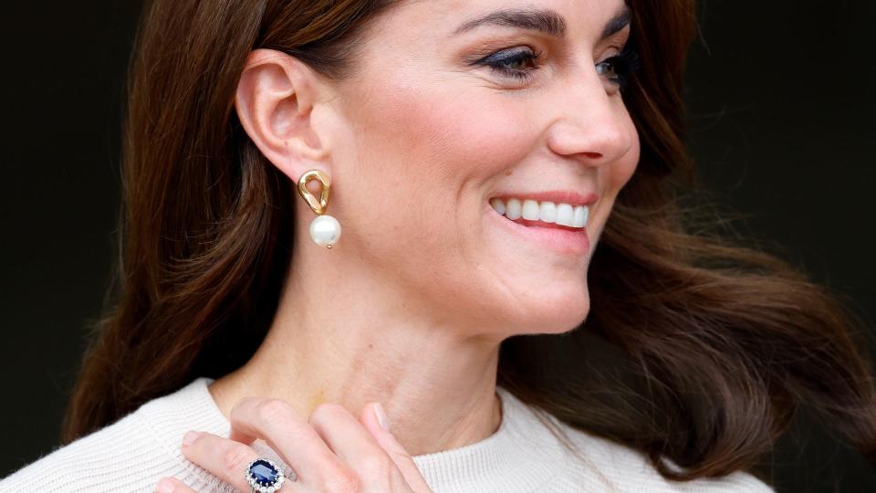 Princess Kate with arm up showing ring