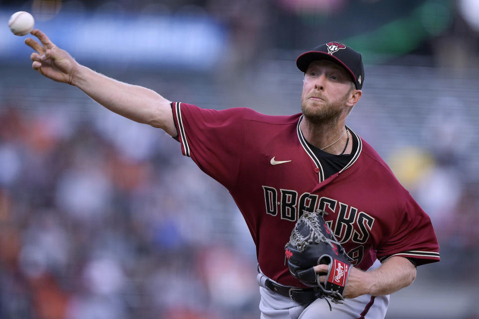 Arizona Diamondbacks starting pitcher Merrill Kelly works against the San Francisco Giants during the first inning of a baseball game Wednesday, June 16, 2021, in San Francisco. (AP Photo/Tony Avelar)
