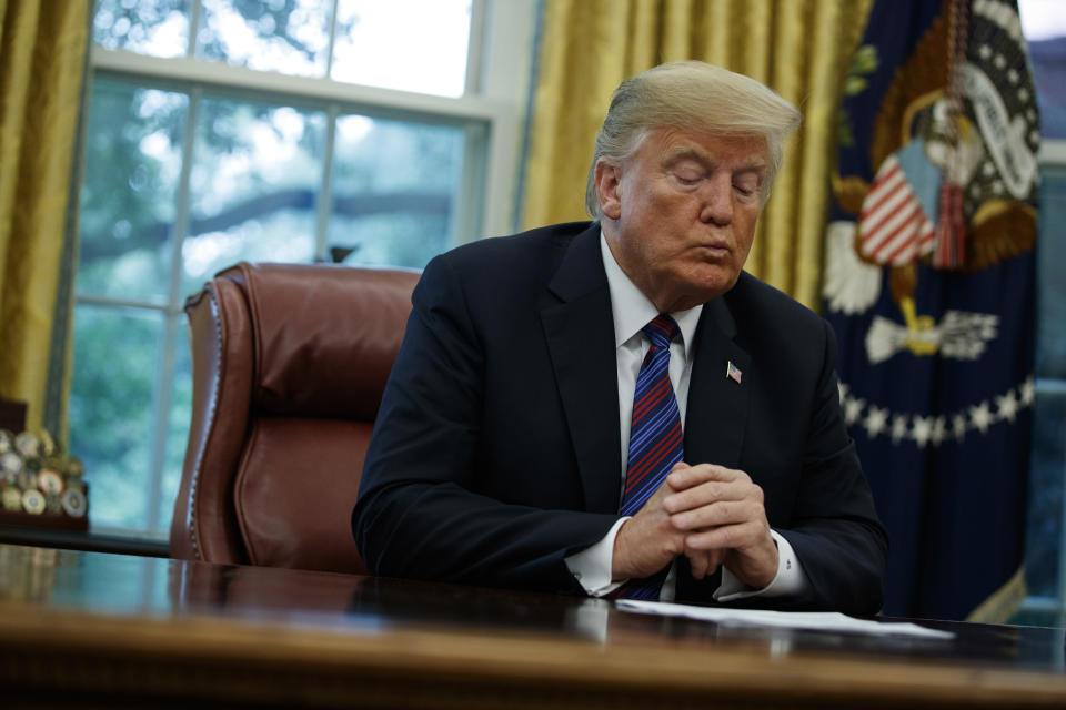 President Donald Trump talks on the phone with Mexican President Enrique Pena Nieto, in the Oval Office of the White House, Monday, Aug. 27, 2018, in Washington. Trump is announcing a trade “understanding” with Mexico that could lead to an overhaul of the North American Free Trade Agreement. Trump made the announcement Monday in the Oval Office, with Mexican President Enrique Pena Nieto joining by speakerphone. (AP Photo/Evan Vucci)