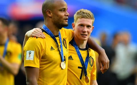 Belgium's Vincent Kompany and Kevin De Bruyne after receiving the bronze World Cup medal - Credit: REUTERS