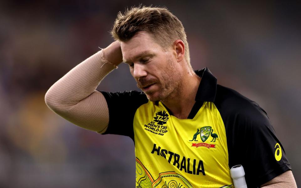 David Warner of Australia leaves the field after being dismissed by Maheesh Theekshana of Sri Lanka during the ICC Men's T20 World Cup 2022 - Shutterstock