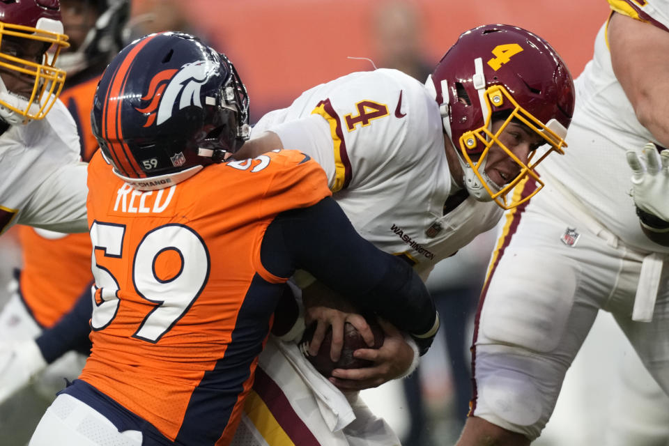 Denver Broncos outside linebacker Malik Reed (59) sacks Washington Football Team quarterback Taylor Heinicke (4) during the second half of an NFL football game, Sunday, Oct. 31, 2021, in Denver. The Broncos won 17-10. (AP Photo/David Zalubowski)