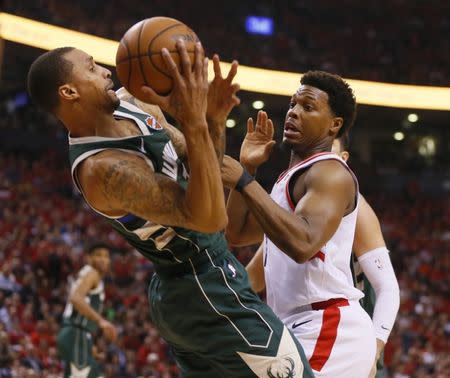 May 21, 2019; Toronto, Ontario, CAN; Toronto Raptors guard Kyle Lowry (7) defends Milwaukee Bucks guard George Hill (3) during the first half in game four of the Eastern conference finals of the 2019 NBA Playoffs at Scotiabank Arena. Mandatory Credit: John E. Sokolowski-USA TODAY Sports