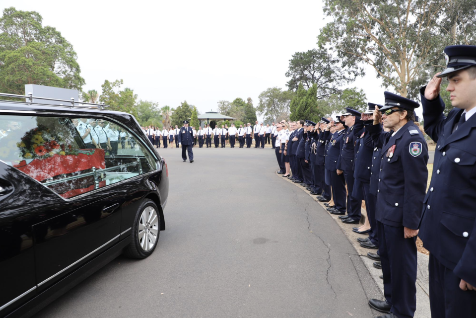 An RFS guard of honour was also formed at the firie's funeral, with hundreds of emergency responders seen solemnly saluting Mr Keaton. 